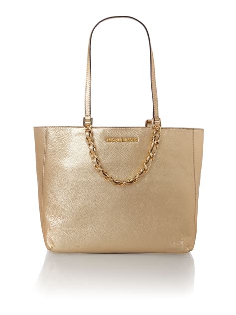 michael kors gold studded clutch|Michael Kors large gold tote.